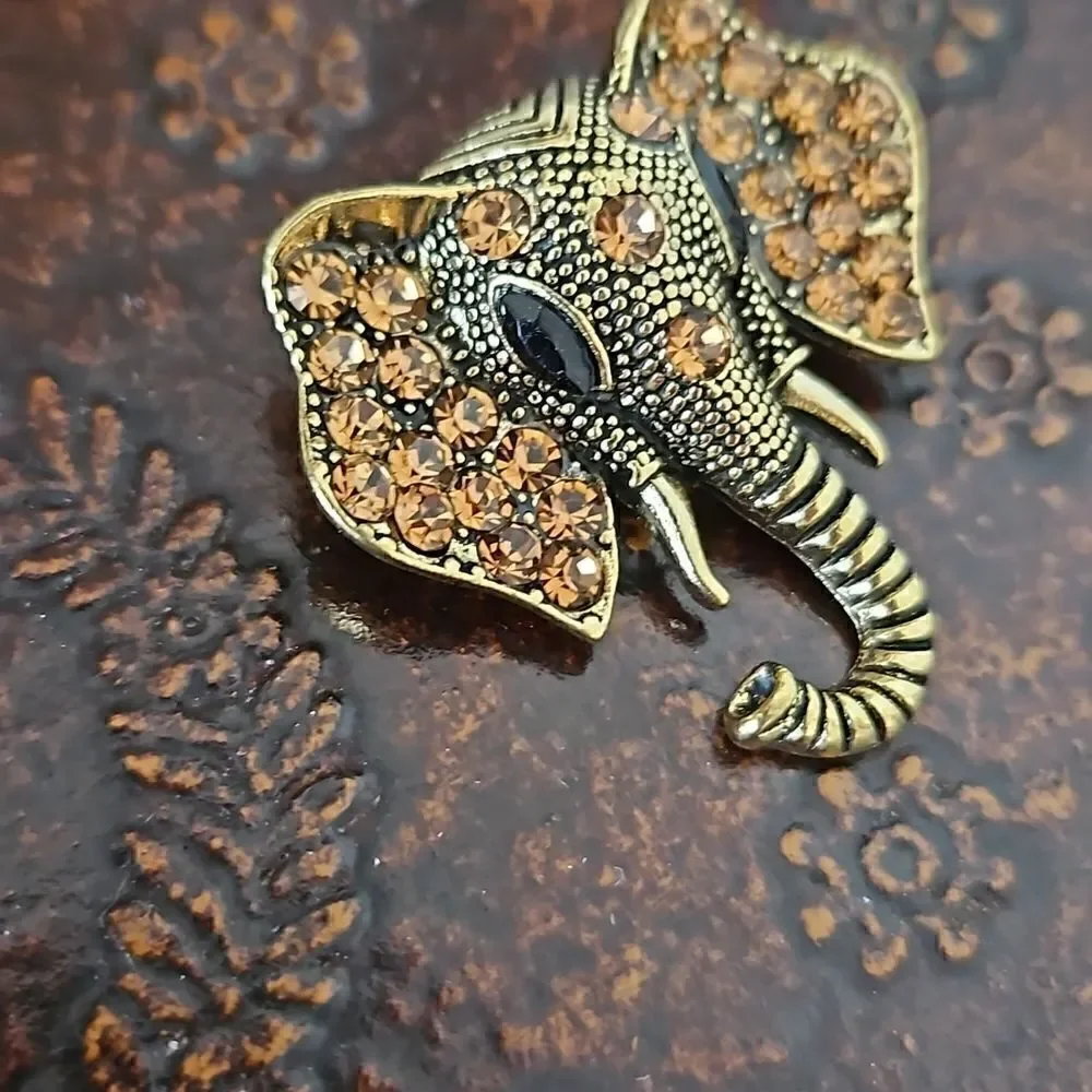 NWOT Gold tone crystal elephant brooch.